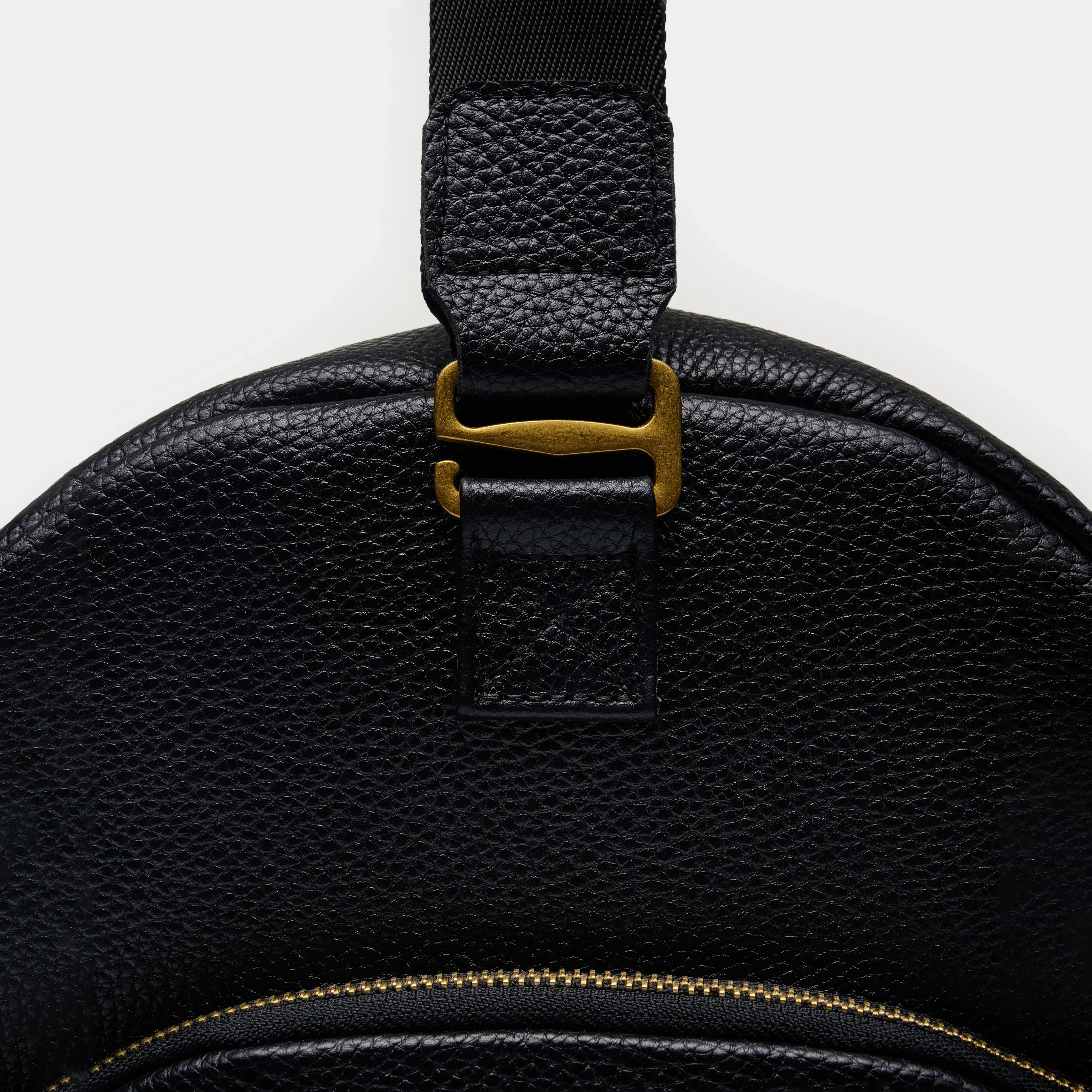 Nomad large black leather travel bag packed for a trip with clothes and shoes