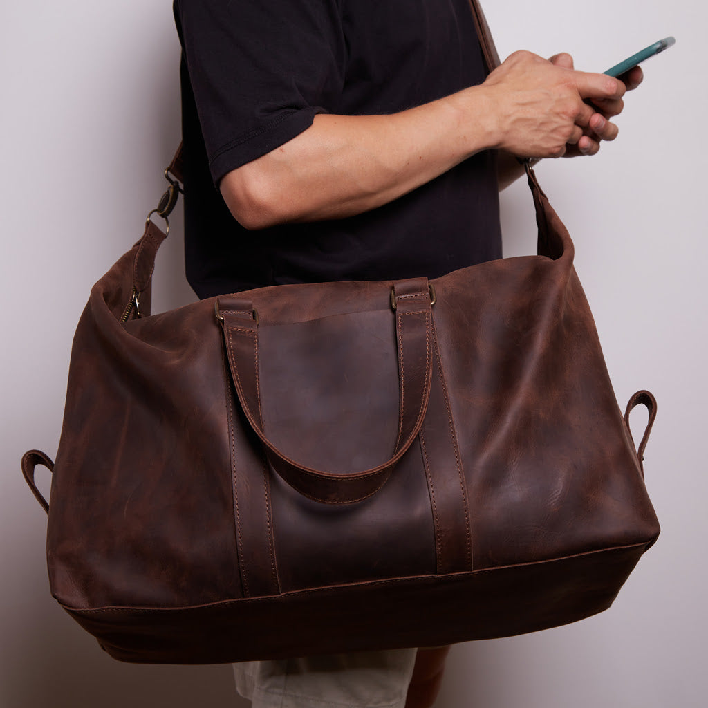 Todo en bolsa de viaje de cuero