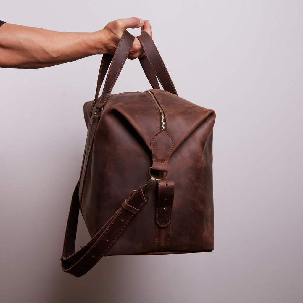 Todo en bolsa de viaje de cuero