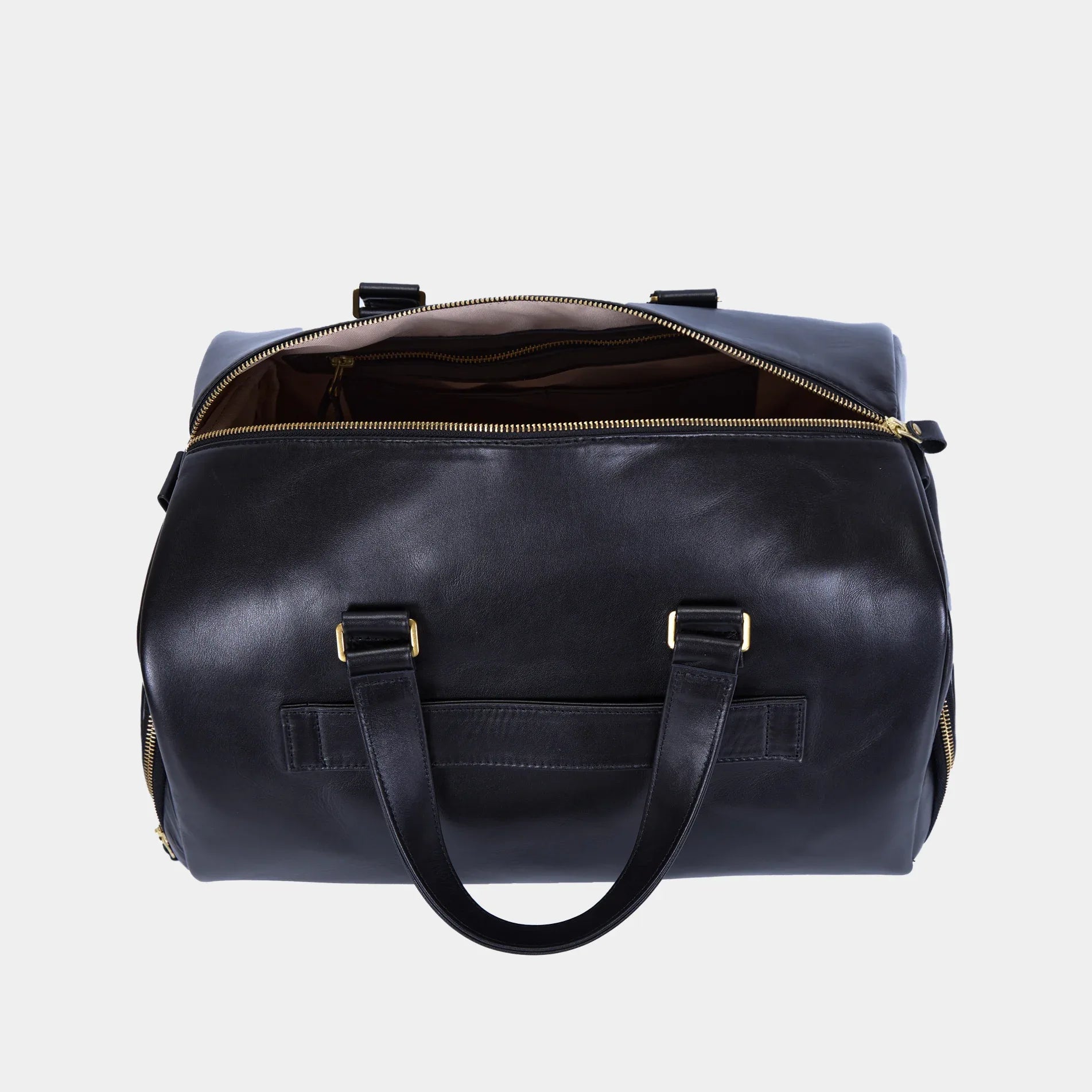 Close up of Nomad bag side zip pocket in smooth black leather with sturdy metal zipper
