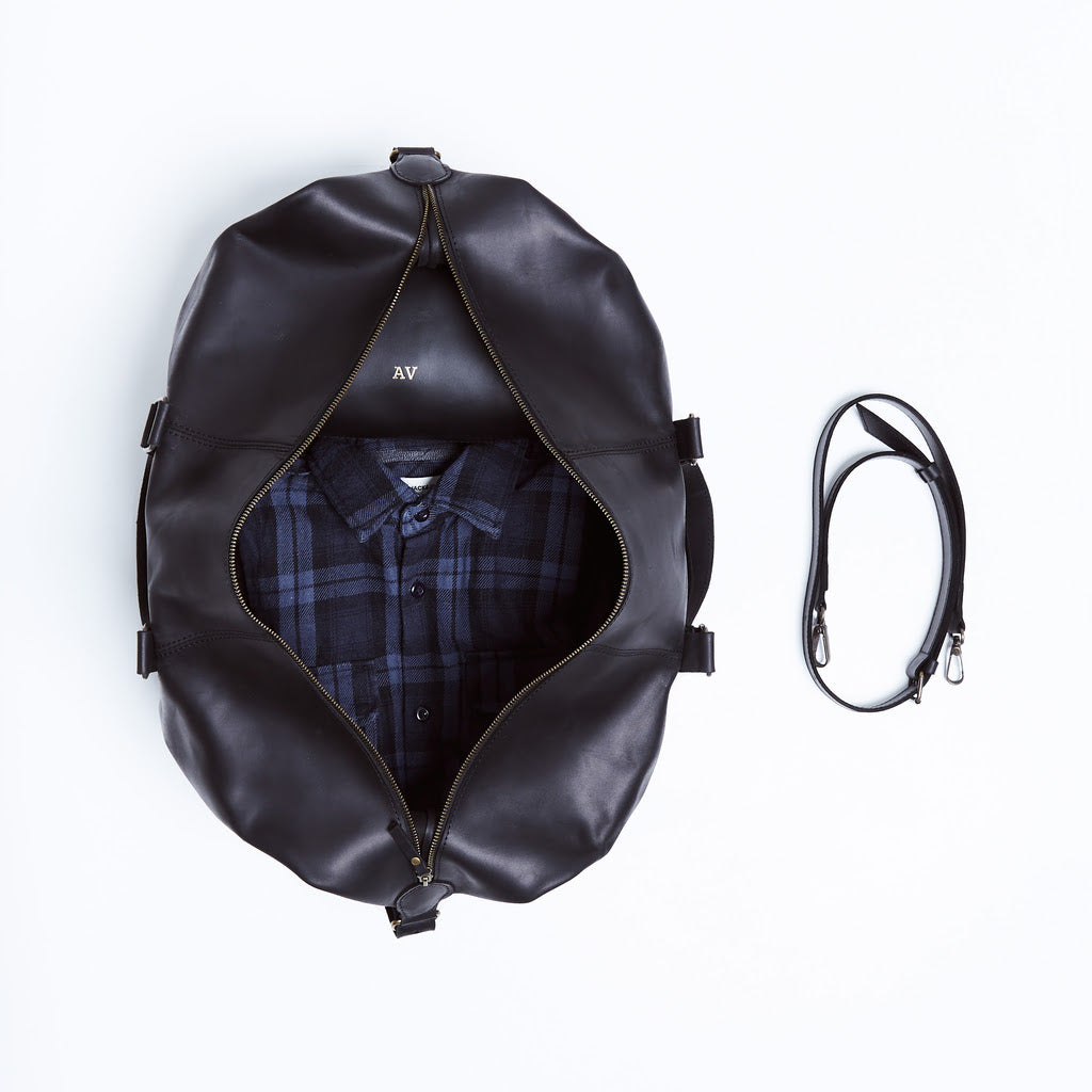 Todo en bolsa de viaje de cuero