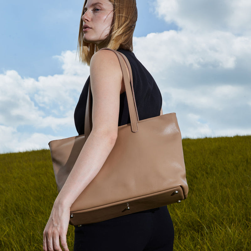 Spacious women's shopper bag with a laptop compartment made from classic leather Emeli